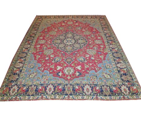 FINE ANTIQUE PERSIAN TABRIZ CARPET, 360cm x 282cm, midnight blue pendant medallion on a ruby field of palmettes and vines wit