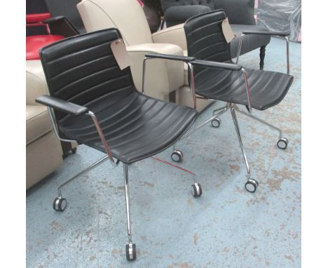 DESK CHAIRS, a pair, Catifa 46, by Arper, in black stitched ribbed leather on chromed legs with castors, 65cm W. (2)