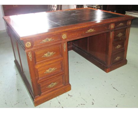 CENTRE PEDESTAL DESK, Empire style mahogany and gilt metal mounted with a rectangular black leather top and nine drawers belo