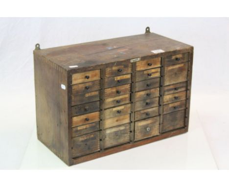 Vintage Wooden collectors Cabinet of multiple drawers, makers plate to front for "Emir London", measures approx 47 x 31 x 23c