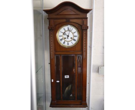 Late 19th / Early 20th century Mahogany Cased Hanging Wall Clock, the white enamel face marked GB with a Crown and Anchor
