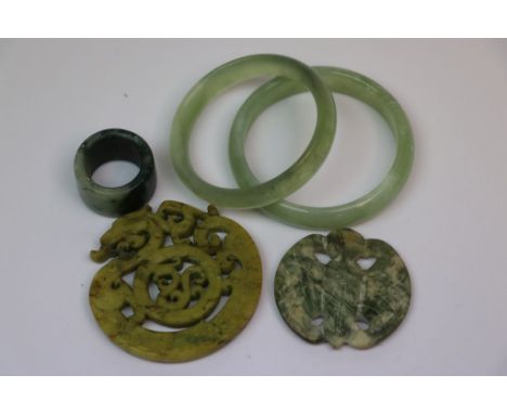 Two vintage carved Chinese Jade or Hardstone Pendants, two Similar Bangles and an Archer type Ring