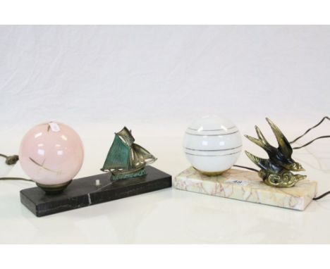 Two Art Deco era Bedside lights with glass Globe shades and marble bases, one set with Yacht the other a Swallow in flight