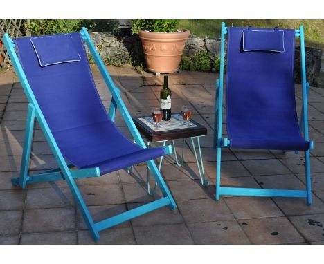 Pair of Vintage Painted Folding Deck Chairs with Canvas Seats together with a Square Tiled Top Side Table raised on blue Hair