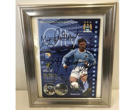 Manchester City 2003 UEFA Cup programme signed by 10 first team players. With COA. Framed & glazed. 