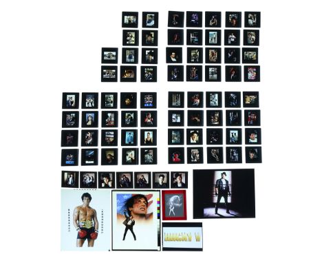 Two transparencies and a negative of assorted elements of various poster concepts with 70 35mm slides of promotional and publ