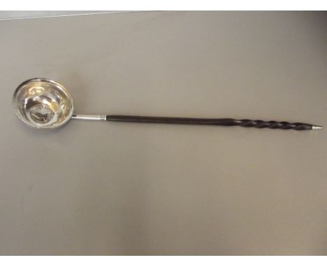 Georgian toddy ladle possibly silver,  baleen whale twist handle, the bowl inset with Queen Anne coin 1777