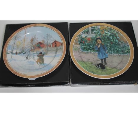 A pair of Artis Orbis Goebel porcelain dishes with design by Carl Larsson, diam. 32cm, each boxed.  