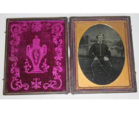 A Victorian ambrotype depicting a soldier within leather case, image approx. 7cm x 9.5cm.  