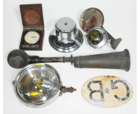 A quantity of automobilia comprising a Lucas no. 60 brass car bulkhead bulb horn, a Smiths car clock in wooden case, a vintag