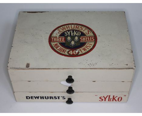 A vintage Dewhurst's "Silko" cotton bobbin chest of drawers and contents, length 30cm.  