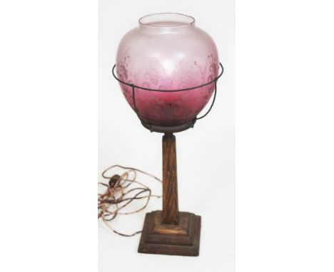 An oak table lamp with etched glass shade, height 47cm.  