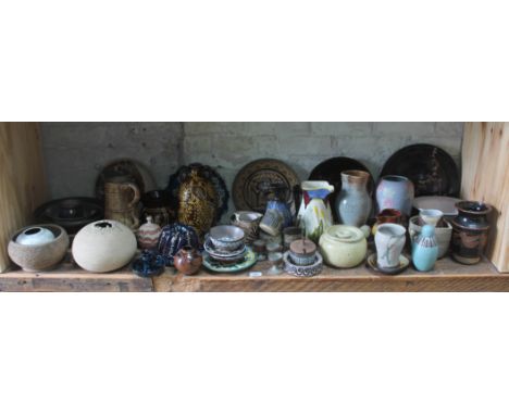 A shelf of mainly studio pottery, various potters and studios, approx. 50 pieces.  