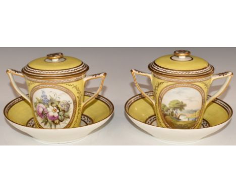 A pair of 18th/19thC twin handled porcelain covered chocolate cups and saucers decorated with a cartouche of flowers and land