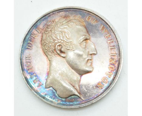 A white metal Duke of Wellington coin / medal with Waterloo verso, diameter 4cm