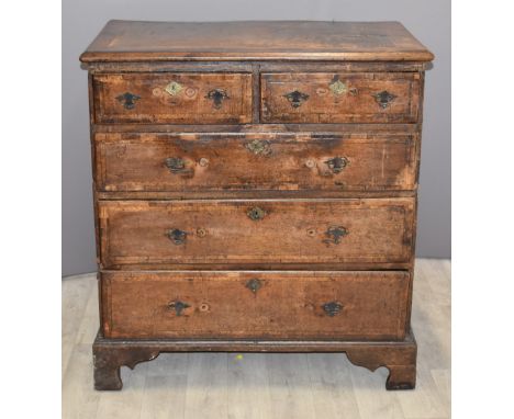 18th/19thC oak chest of two over three drawers with crossbanded and feathered decoration, raised on bracket feet, W95 x D56 x