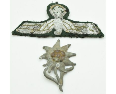 German Army WW2 Gebirgsjager Mountain Troops Edelweiss metal badge, together with a cloth officer's breast badge', acquired b