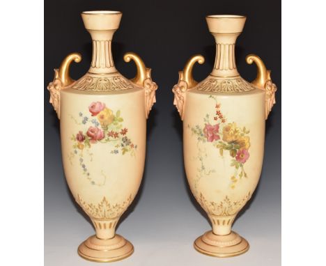 Pair of Royal Worcester blush ivory pedestal vases with twin mask handles, H27cm