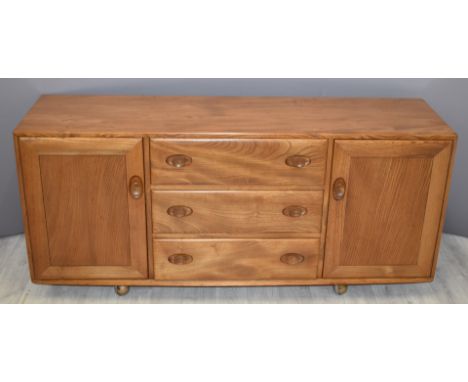 Retro / mid century Ercol light elm Windsor sideboard comprising of three central drawers with cupboard either side - H68 x D