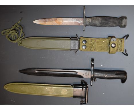 WW2 American M7 bayonet with 16.5cm blade and scabbard marked US M8A1, together with a copy of an M1 example with 25cm blade 