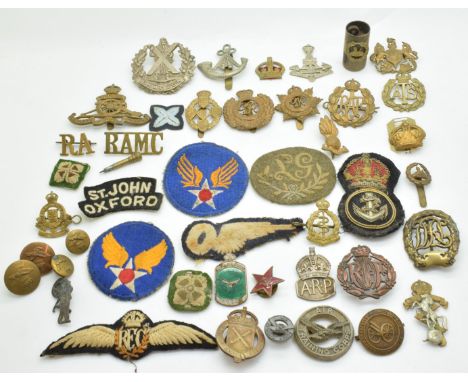 Small collection of military and Civil Defence metal and cloth badges and insignia including ARP hallmarked silver badge, Cov