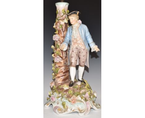 A late 19th/20thC Volkstedt figural lamp with applied flower decoration, H32cm