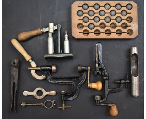 A collection of 16 bore shotgun re-loading and shooting accessories comprising capper and decapper, cartridge extractor, cart