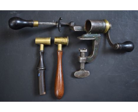 W Bartram Nimrod 12 bore shotgun cartridge rollover tool together with two brass powder measures, all with turned wooden hand