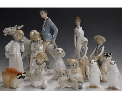 Lladro style figures including man on a donkey, Nao, Lomonosov etc, tallest 36cm