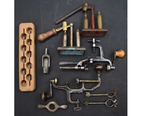 A collection of 16 bore shotgun re-loading and shooting accessories comprising two capper and decappers, two cartridge extrac