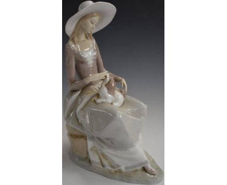 Lladro figurine of a lady with lap dog, H33cm