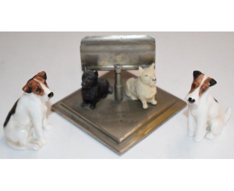 Two Royal Doulton K Series dog figures and a Buchanan's 'Black and White' Scotch Whiskey figural dog letter rack, tallest 7cm