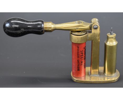 Brass 16 bore shotgun cartridge capper and decapper tool with turned wooden handle and Eley shotgun cartridge case.&nbsp;