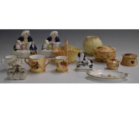 A collection of Royal Worcester miniatures, Staffordshire figural pen holders, Chelsea style figure etc, tallest 7.5cm