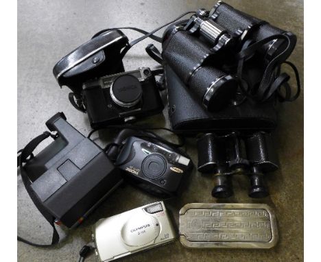 A Yashica minister-D camera, a Polaroid camera, a pair of binoculars marked Paris, a pair of Boots 10x50 binoculars, etc.