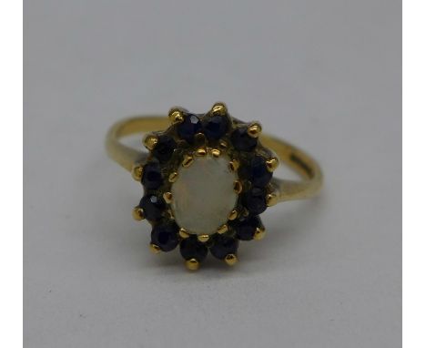 A 9ct gold, opal and sapphire ring, 2.5g, K