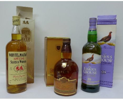 Three bottles of Scotch Whisky, Bell's, Whyte & Mackay and Famous Grouse, boxed