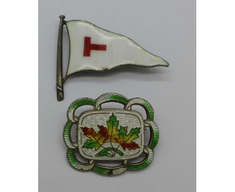 A silver and enamel brooch and an enamel flag brooch