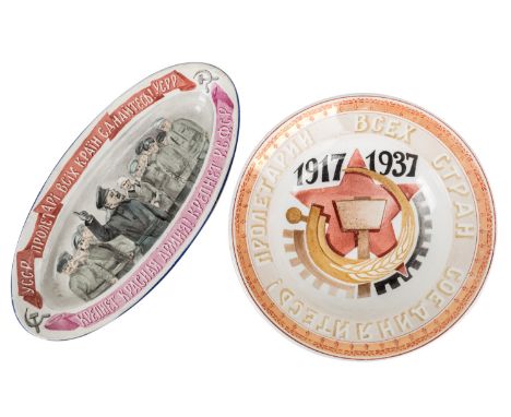 A PAIR OF COMMEMORATIVE SOVIET PLATES, 1923-1937comprising:a) an oval plate depicting Leon Trotsky in front of Red Army soldi