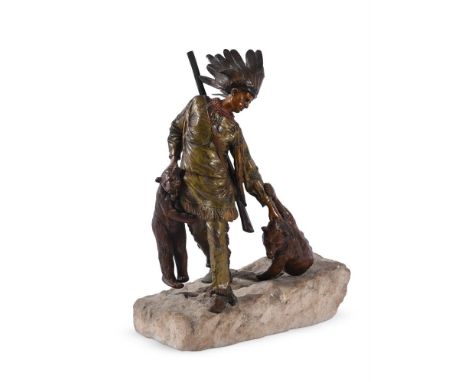 AN AUSTRIAN COLD PAINTED BRONZE MODEL OF A NATIVE AMERICAN HUNTER WITH TWO BEAR CUBS ON A NATURALISTICALLY MODELLED ROCK BASE