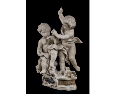 A CARVED WHITE ALABASTER FIGURAL GROUP OF TWO PUTTI 18TH/19TH CENTURY, PROBABLY ITALIANThe figures with sword and balance sca