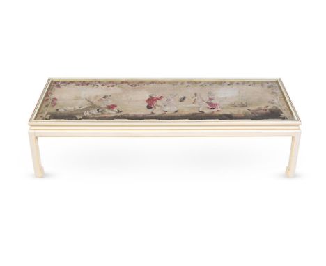 A WHITE AND GOLD PAINTED LOW TABLE20TH CENTURY The rectangular glazed top enclosing a tapestry fragment depicting children da