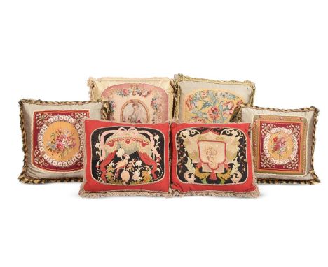 SIX LARGE CUSHIONSINCORPORATING 18TH CENTURY AND LATER WOOLWORK AND TAPESTRY AND LATER FABRICThe largest approximately 70cm x