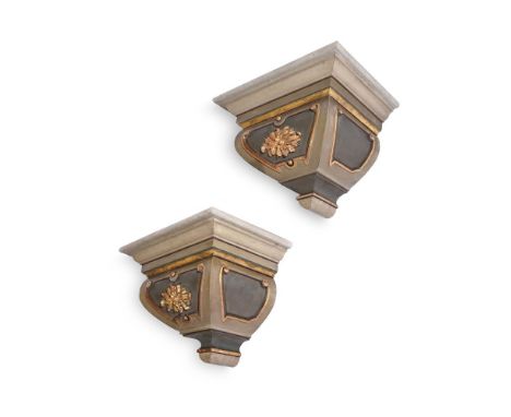 A PAIR OF PAINTED PINE WALL BRACKETS IN AN ARCHITECTURAL STYLEMODERNPainted in shades of pale green and gilt 44cm high, 58cm 