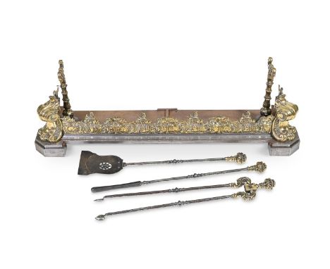 A MID VICTORIAN BRASS AND STEEL FIREPLACE FENDER AND A SET OF THREE FIRE IRONSTHIRD QUARTER 19TH CENTURY  The fender of recta