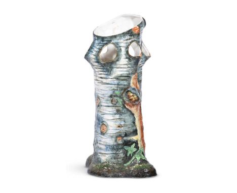 A BELGIAN POTTERY PLANTER FIRST QUARTER 20TH CENTURYnaturalistically modelled and decorated in coloured glazes as a tree stum