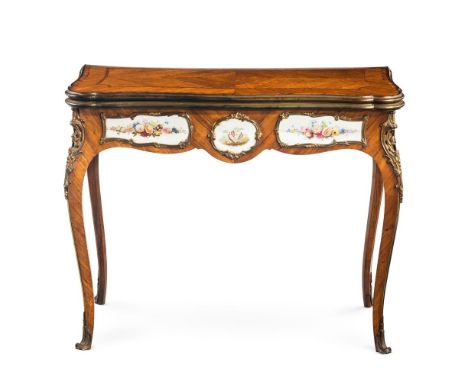 Y AN EARLY VICTORIAN PORCELAIN AND GILT BRONZE MOUNTED TULIPWOOD CARD TABLEBY G J MORANT, MID 19TH CENTURY The shaped rectang
