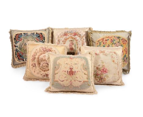 SIX LARGE CUSHIONSINCORPORATING 18TH CENTURY AND LATER WOOLWORK AND TAPESTRY AND LATER FABRIC The largest approximately 80cm 