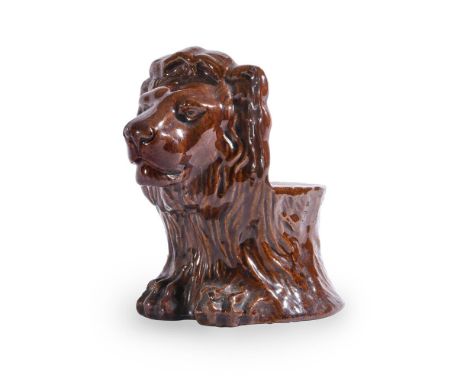 A STAFFORDSHIRE TREACLE GLAZED SASH WINDOW STOP, MODELLED AS A LIONMID 19TH CENTURY12.5cm highCondition Report: No damage det