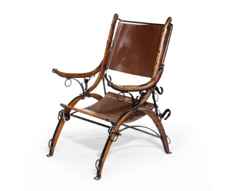 A LATE VICTORIAN BLACK-PAINTED IRON AND STAINED BEECH ARMCHAIRLATE 19TH CENTURYThe arms, legs and stiles made from horse carr